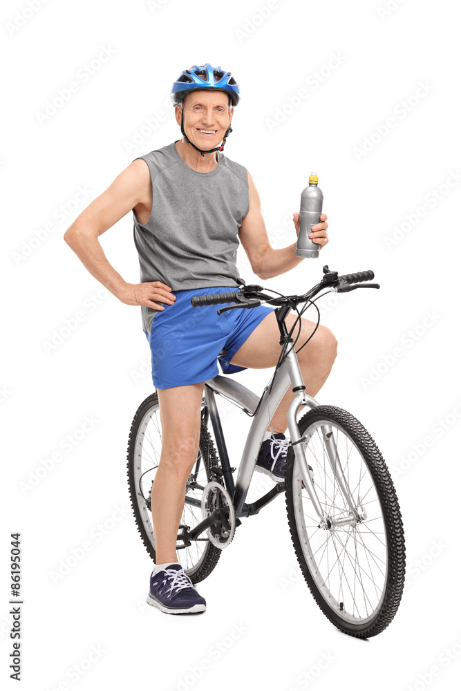 Senior man posing on his bike Senior man posing on his bike
