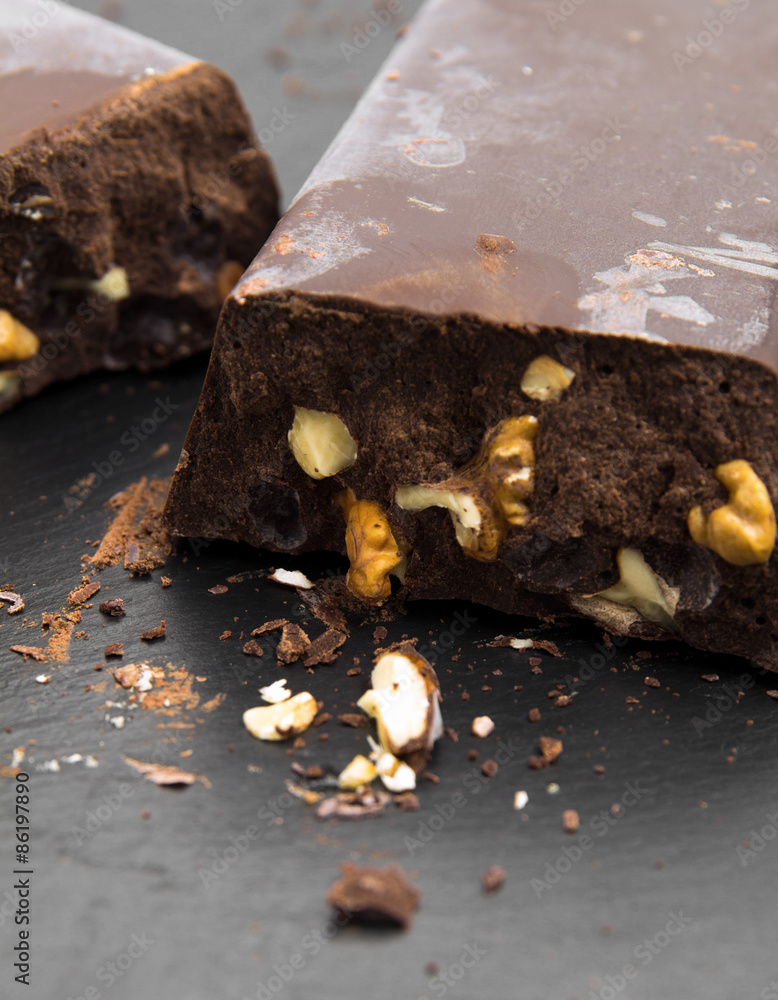 Fototapeta premium very thick brick of chocolate with walnut