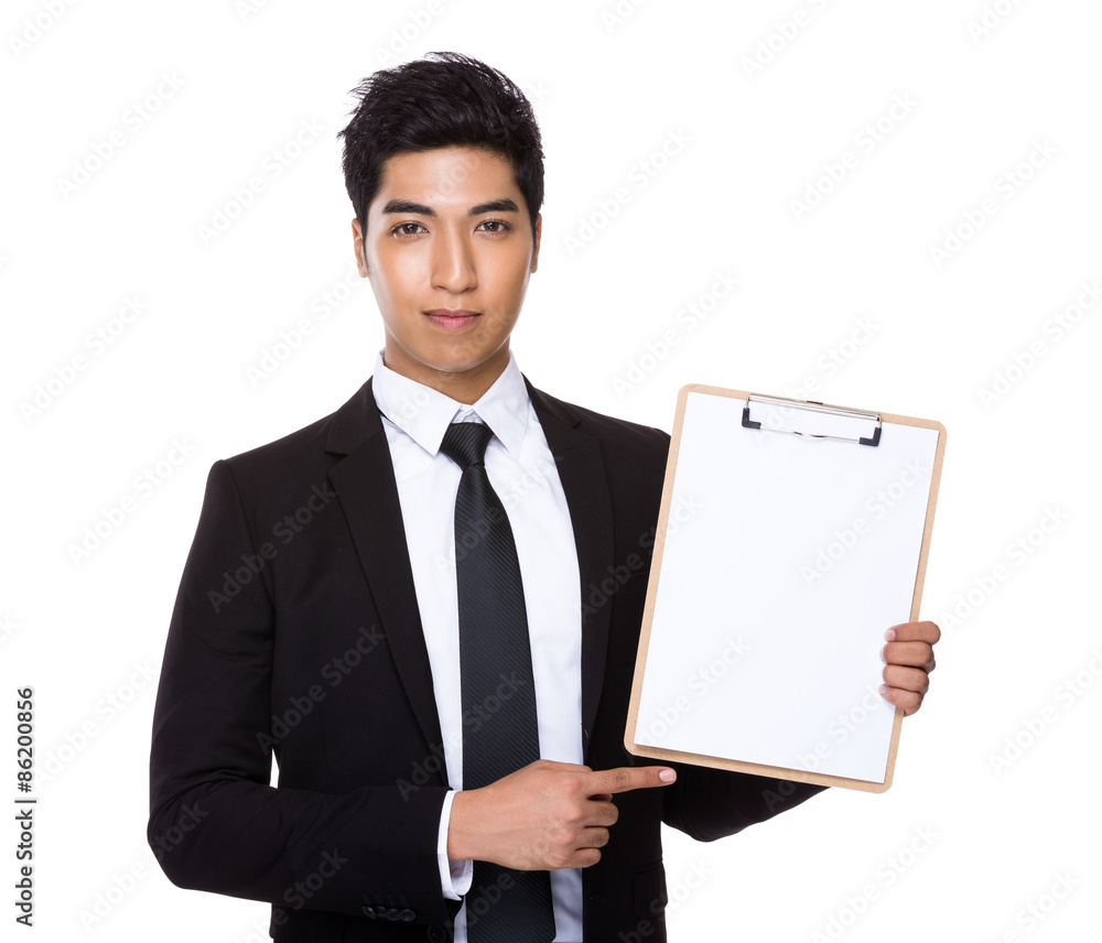Indian businessman show with the blank page of the clipboard Indian businessman show with the blank page of the clipboard