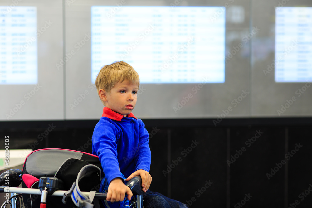 little boy waiting in the airport little boy waiting in the airport