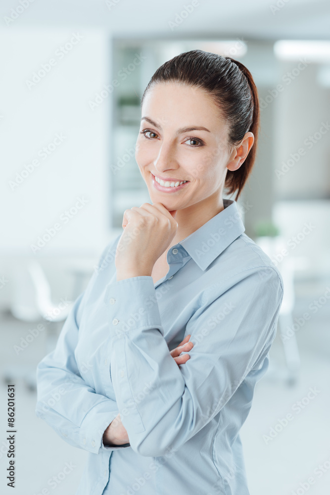Beautiful young woman posing with hand on chin Beautiful young woman posing with hand on chin