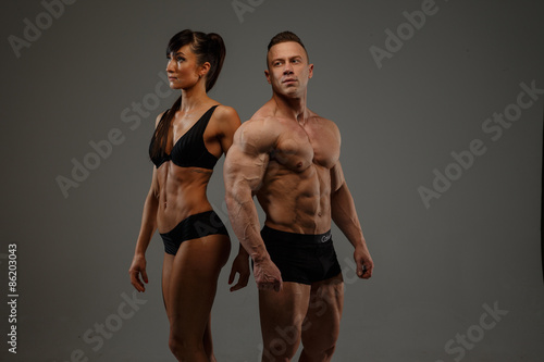 Couple of fitness woman and man bodybuilder