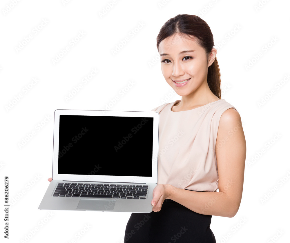 Asian Businesswoman show with the blank page of laptop computer Asian Businesswoman show with the blank page of laptop computer