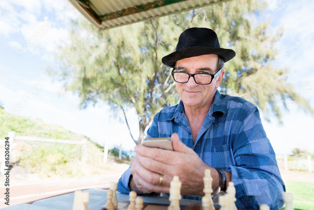 Fototapeta premium Old man with his mobile