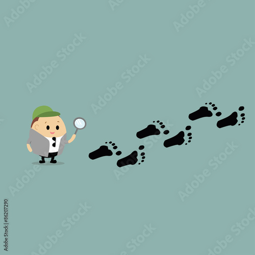 Vector of Cartoon of a detective, following the footprints 