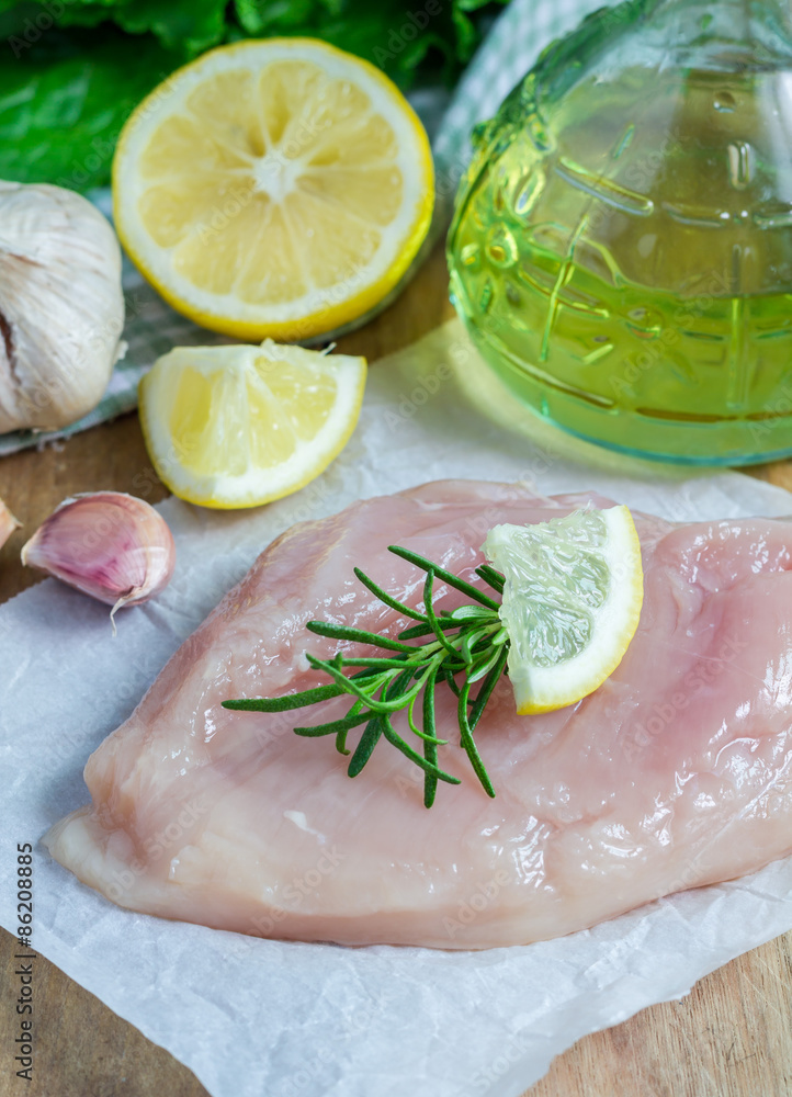 Raw chicken fillet with herbs and spices Raw chicken fillet with herbs and spices