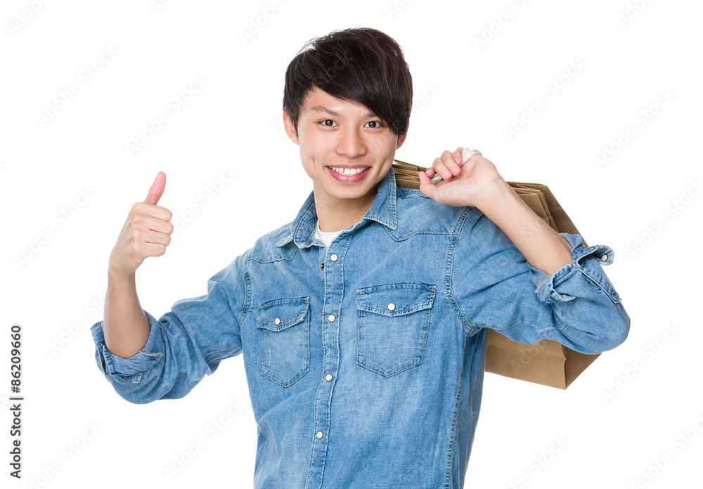 Man carry with shopping bag and thumb up Man carry with shopping bag and thumb up