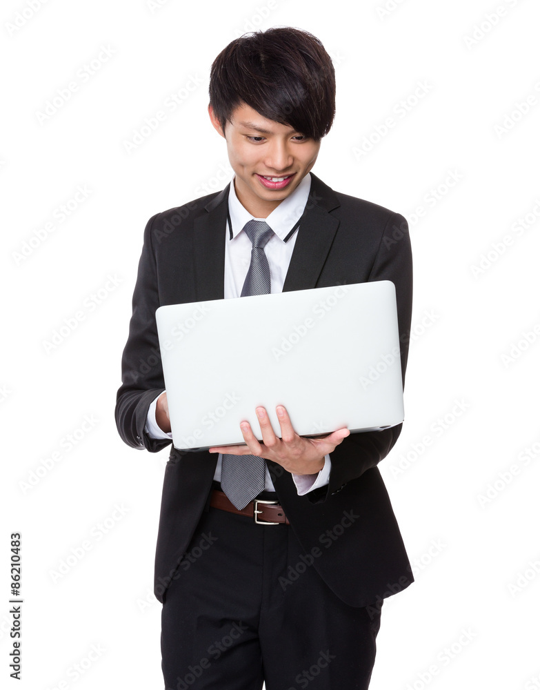 Asian businessman use of the laptop computer Asian businessman use of the laptop computer