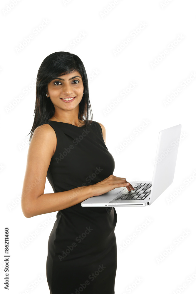 Close up portrait of a smiling Indian business woman working on a laptop. isolated on white.. Close up portrait of a smiling Indian business woman working on a laptop. isolated on white..