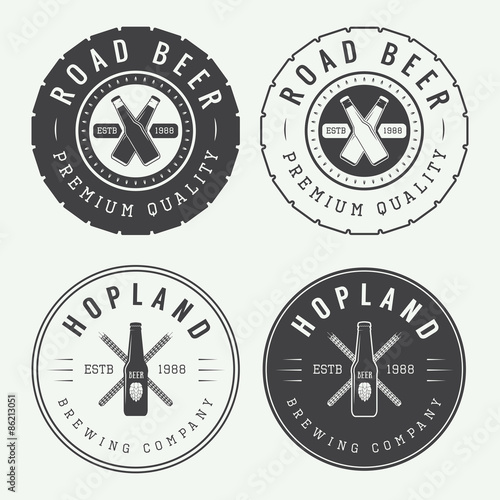 Set of vintage beer and pub logos, labels and emblems with bottles, hops, tires and wheat