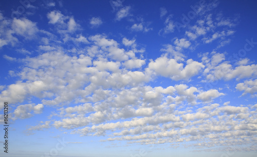 Beautiful cumulus cirrus clouds in blue sky.