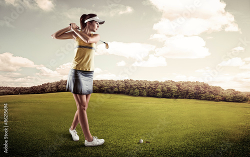 Young concentrated golf player holding club preparing for shot