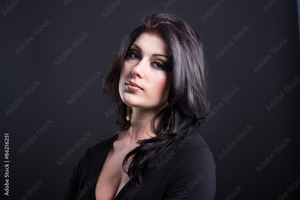 Portrait of a beautiful young brunette. Beautiful woman with shiny hair. Impressive woman Portrait of a beautiful young brunette. Beautiful woman with shiny hair. Impressive woman