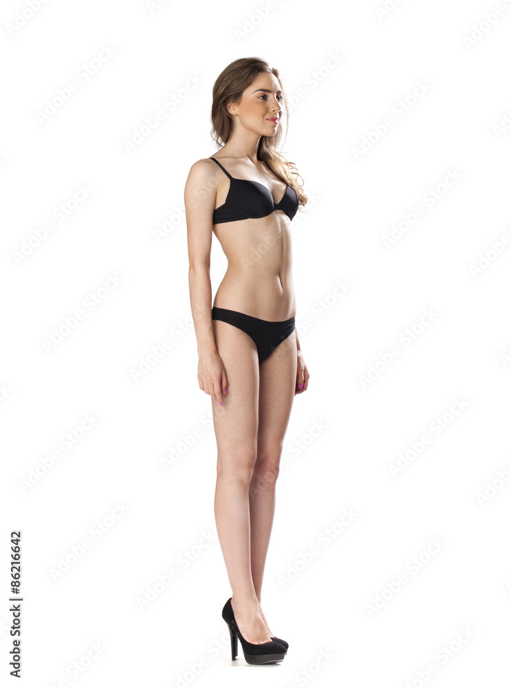 Full length portrait of a beautiful young model in black bikini Full length portrait of a beautiful young model in black bikini