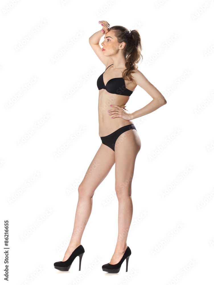 Full length portrait of a beautiful young model in black bikini Full length portrait of a beautiful young model in black bikini