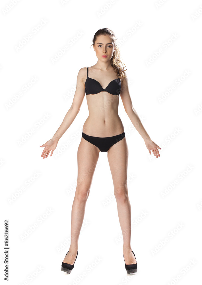 Full length portrait of a beautiful young model in black bikini Full length portrait of a beautiful young model in black bikini