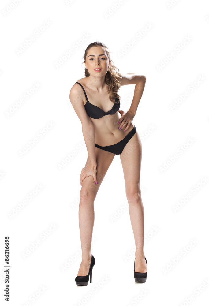 Full length portrait of a beautiful young model in black bikini Full length portrait of a beautiful young model in black bikini