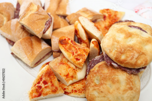 plate of sandwiches with corpses, buns and pizza