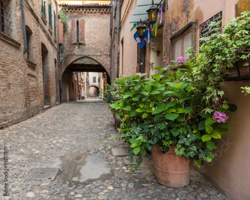 Fototapeta Naklejka Na Ścianę i Meble -  Ancient medieval street in the downtown of Ferrara city
