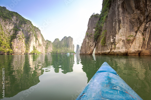 Kayaking among the rocks of Halong Bay in Vietnam