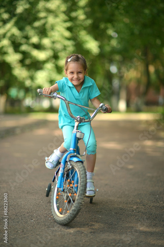 Little girl with bicycle  © aletia2011