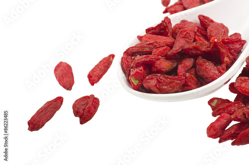Spoon with Group of Goji berry on the white