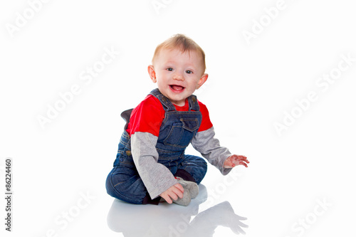 portrait of smiling baby boy isolated on white background
