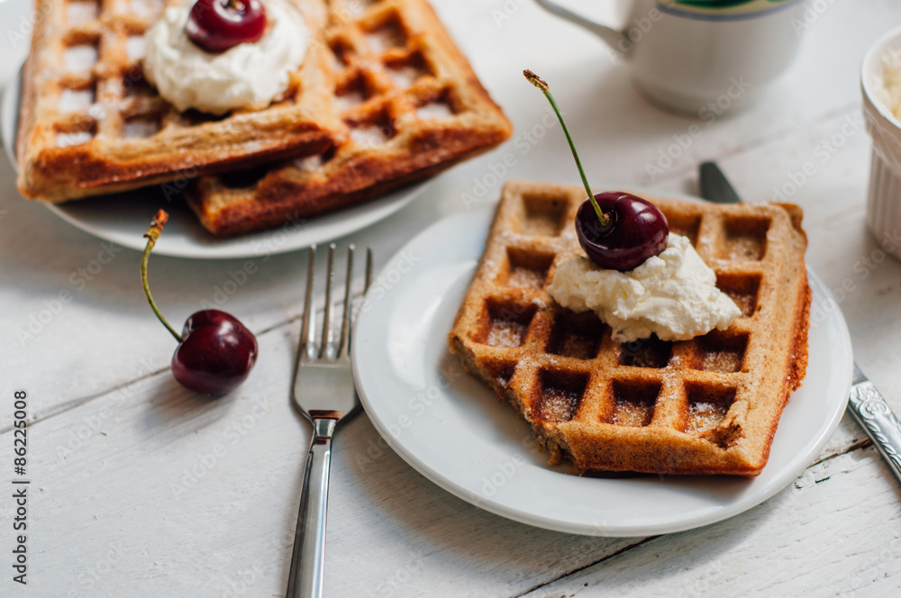 Breakfast with wholegrain waffles and whipped cream Breakfast with wholegrain waffles and whipped cream