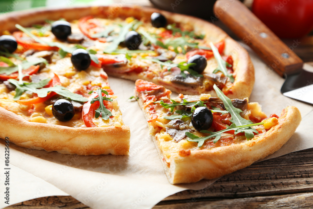 Fresh tasty pizza on brown wooden background Fresh tasty pizza on brown wooden background