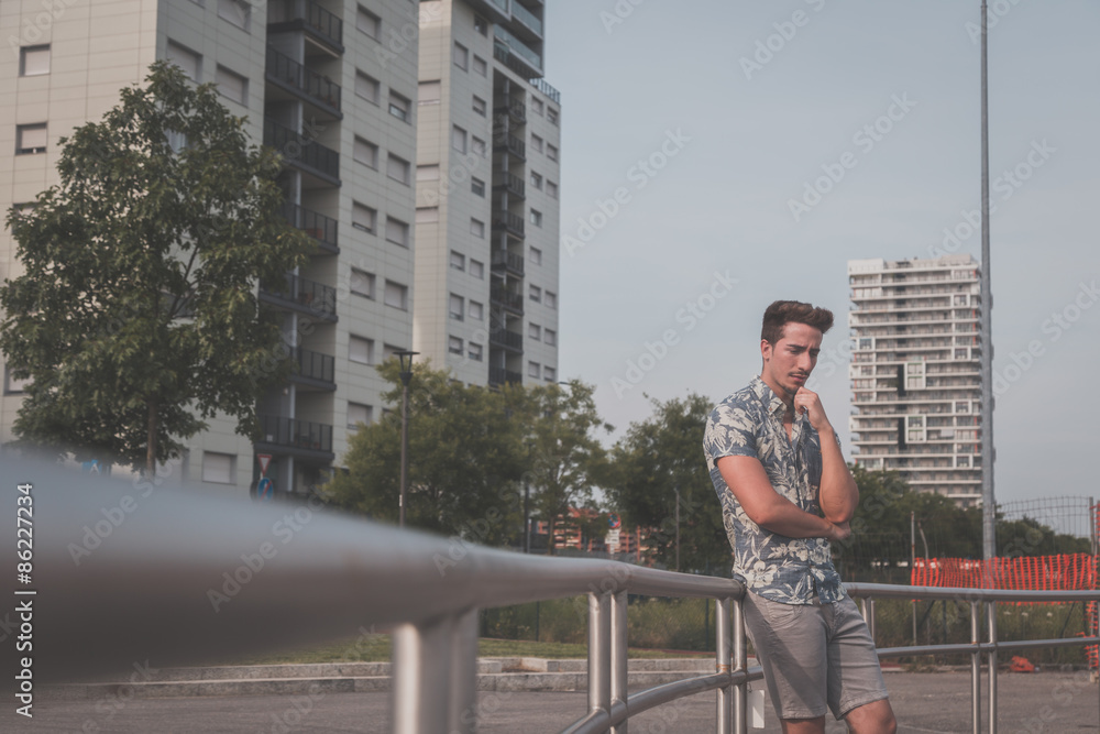 Young handsome man posing in the street Young handsome man posing in the street