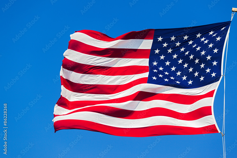 Fototapeta premium American flag on the blue sky