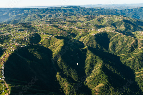 Aerial flying Inanda valleys outside Durban South Africa rural countryside hills valleys homes landscape