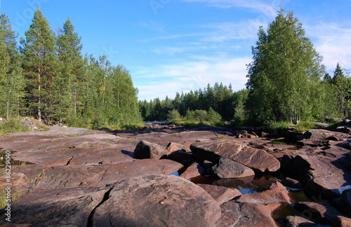 Stony river bed of the Pongoma river. Karelia, Russia.