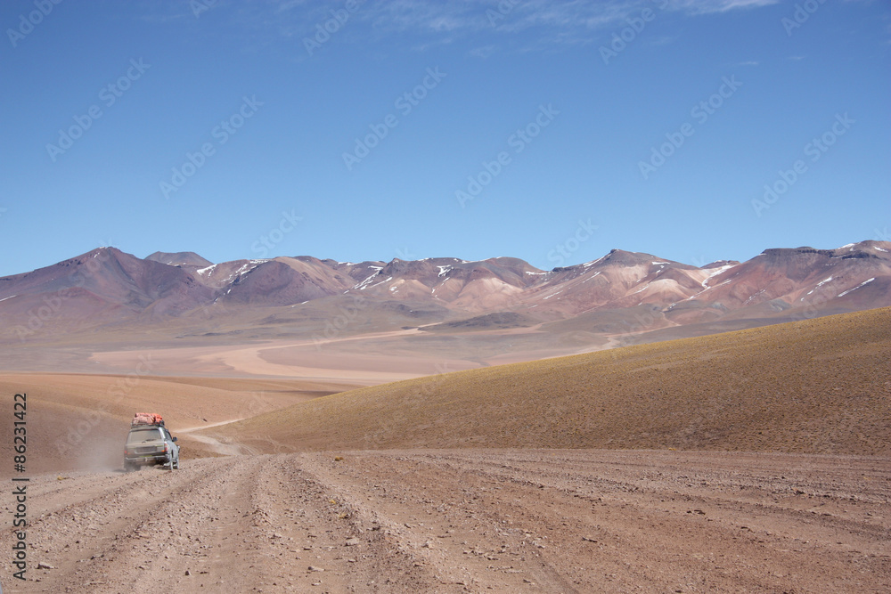 Tourist car at the Atacama Desert in Bolivia - Chile mounains
