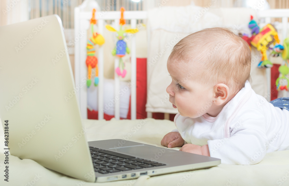 Little baby looking at the computer Little baby looking at the computer