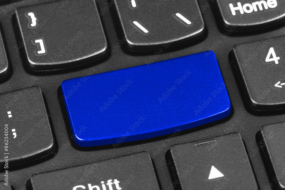 Computer notebook keyboard with blank blue key Computer notebook keyboard with blank blue key