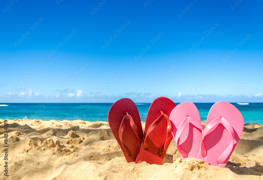 Red and pink flip flops on the sandy beach Stock Photo | Adobe Stock
