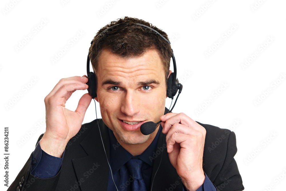 Handsome smiling customer service operator with headphones on his head Handsome smiling customer service operator with headphones on his head