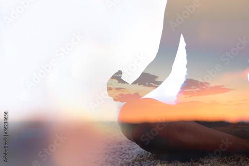 Double exposure of young woman  practicing yoga in nature