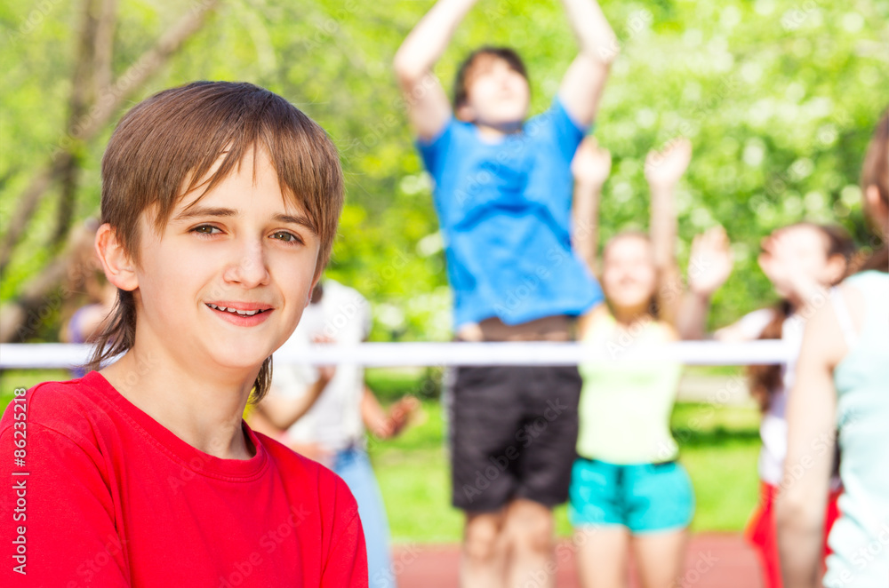 Obraz premium Portrait of smiling boy standing on playground