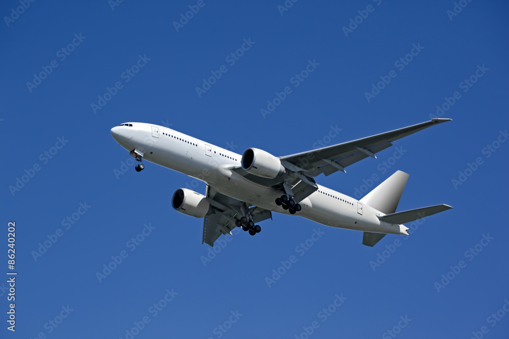 flying airplane on blue sky background