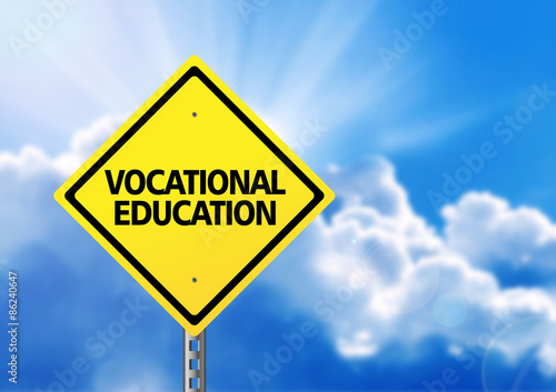 Yellow road sign with text vocational education. photo