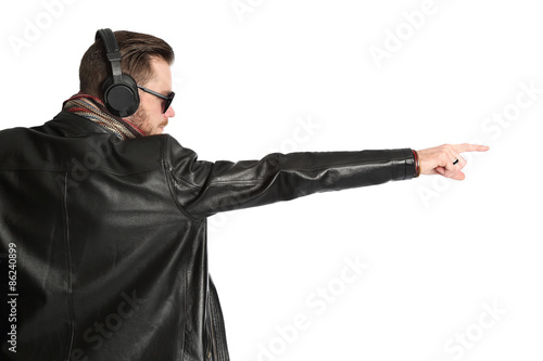 Attractive DJ wearing a black leather jacket and sunglasses 