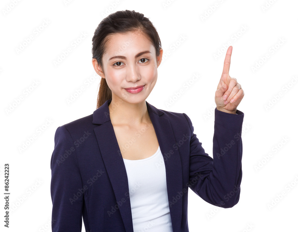 Young businesswoman with finger showing up Young businesswoman with finger showing up