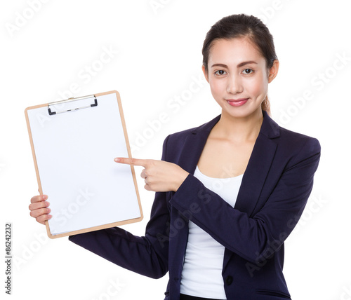 Businesswoman finger point to clipboard