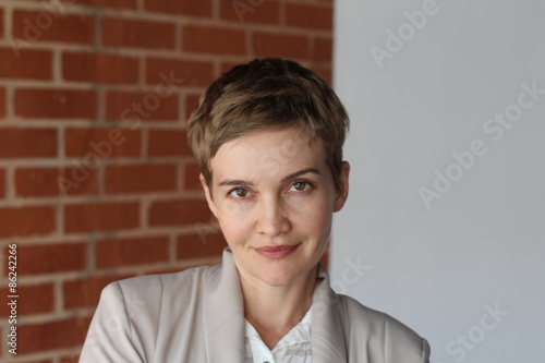 Portrait of blond woman with trendy hairstyle