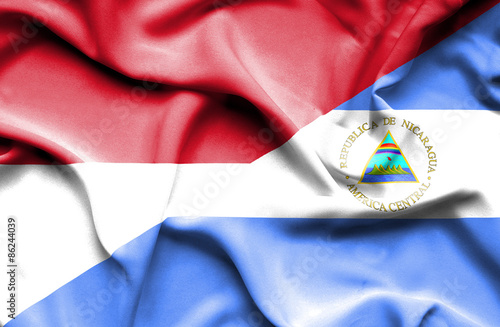 Waving flag of Nicaragua and Indonesia
