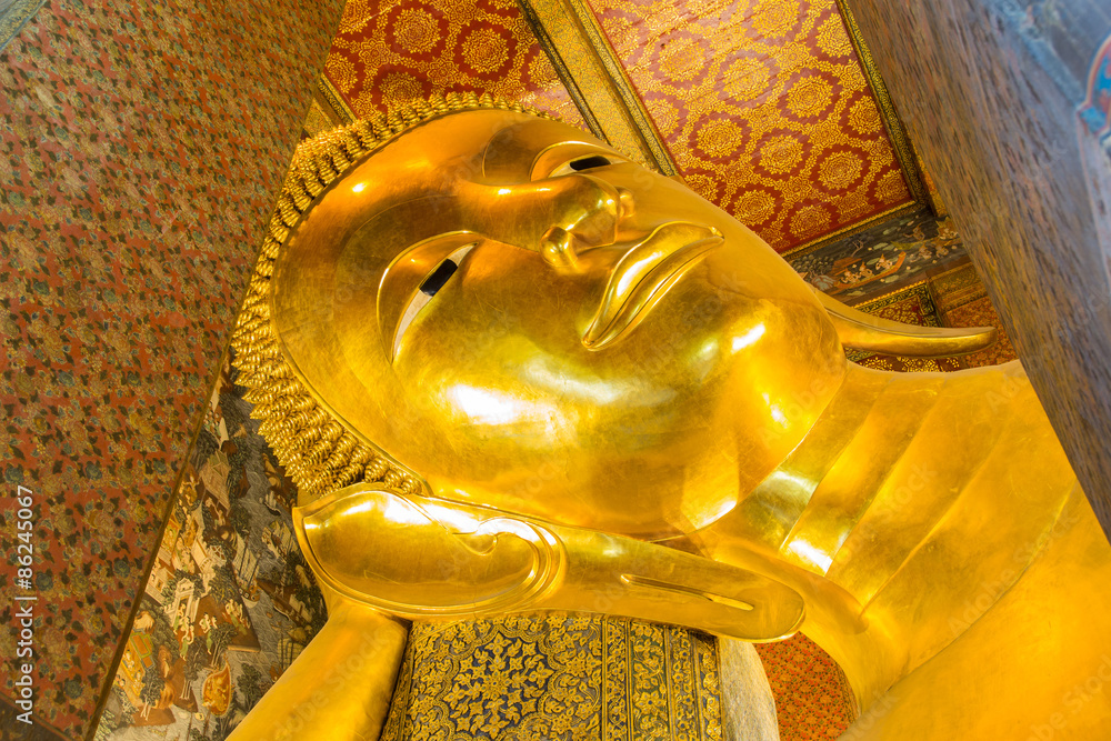 Close up Reclining Buddha gold statue ,Wat Pho, Bangkok, Thailand