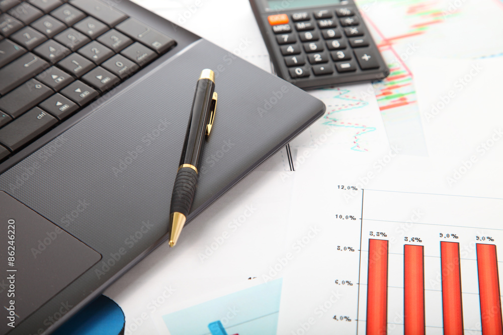 Calculator, laptop,tablet and financial documents Calculator, laptop,tablet and financial documents