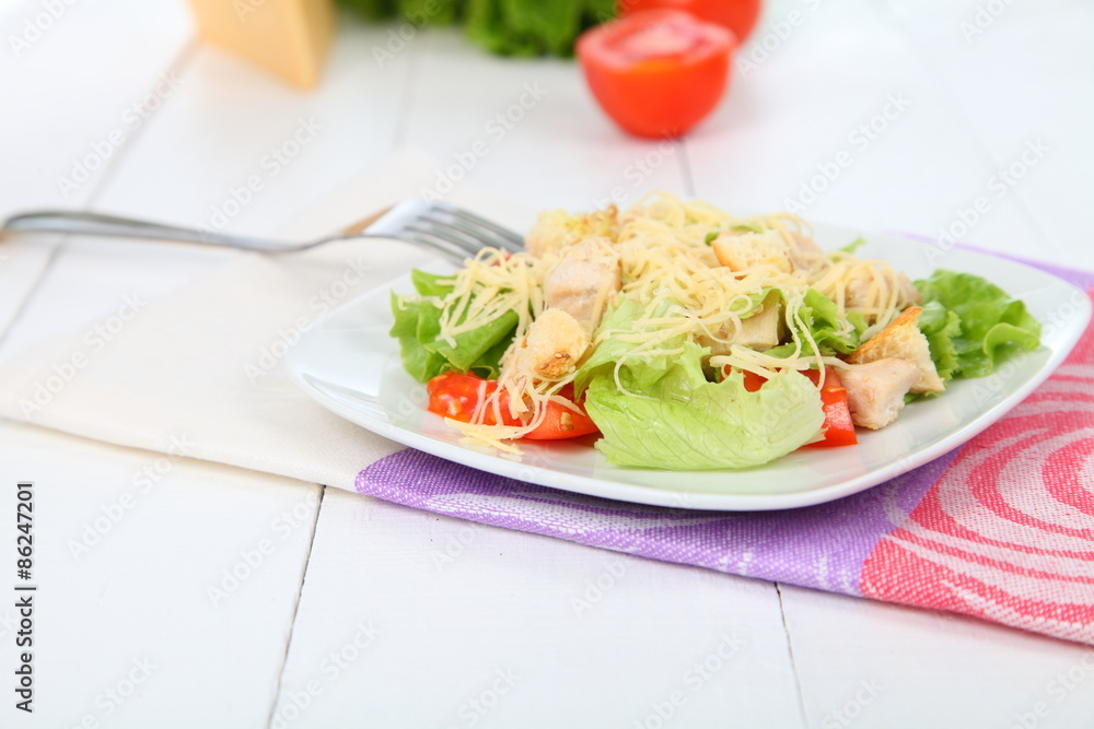 Caesar salad in a white plate Caesar salad in a white plate